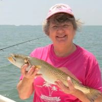 A CAPPA retiree shows off a fish they caught.