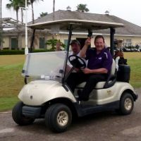 CAPPA retirees on a golf cart.